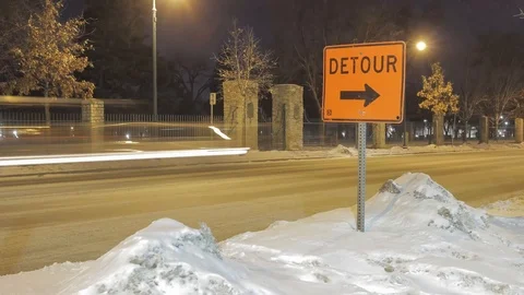 Upper Right Third Detour Sign with Traffic at Night Stock Footage 85574284