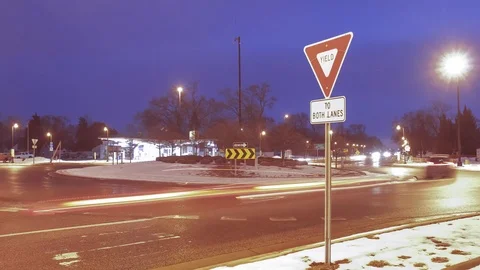 Upper Right Third Yield Sign at a Roundabout Blue Hour Stock Footage 85574678