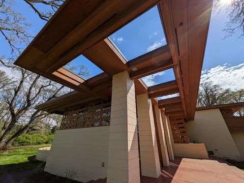 Upper section of the Gordon House displays towering skylights, concrete supports Stock Photos