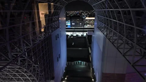 The upper section of Kyoto Station at night in Kyoto, Japan, displays steel 動画素材 297763820