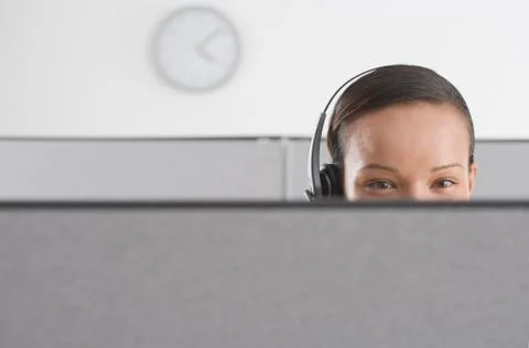 Upper section of woman's head in office Foto stock