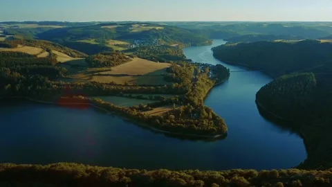 Upper Sure Lake drone tracking shot | HD aerial Video stock 134554207