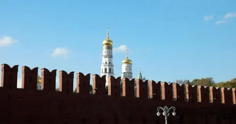 The upper tier of the Ivan the Great Bell tower, Kremlin wall Stock Footage 68914615
