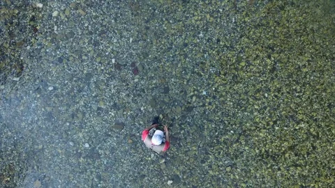 Upper vertical view fisherman performs spinning cast Video stock 102346697