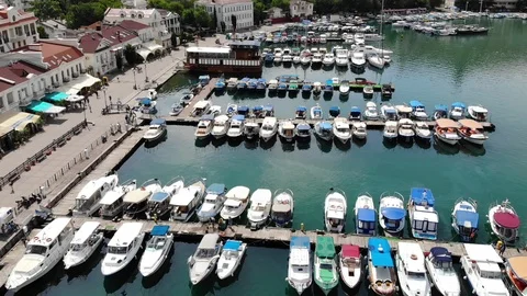 Upper view multicoloured motorboats moor at sea bay piers Video stock 103181732