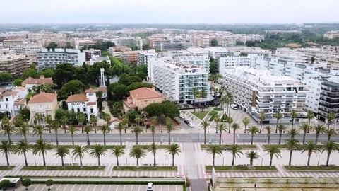 Upper view palms promenade and road against modern hotels Stock Footage 103298815