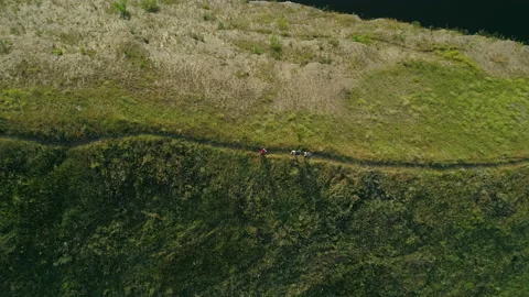 The upper view on people standing on mountain trail Stock Footage 159823979