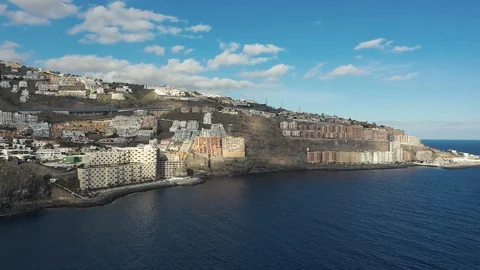 Upper view resort city with hotels on rocky hills at ocean Stock Footage 101964852