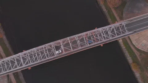 Upper view river bridge with traffic autumn forestry banks Stock Footage 103314020