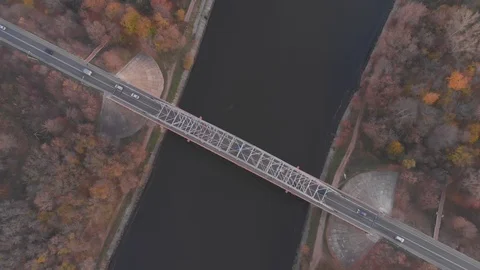 Upper view river bridge with traffic autumn forestry banks Stock Footage 104048072