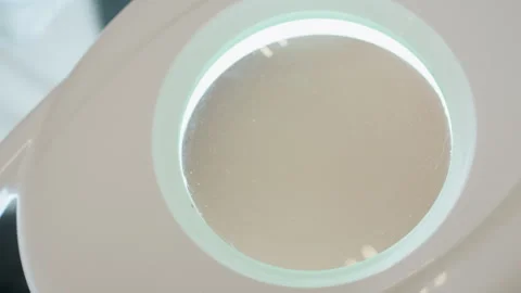 Upper View of White Magnifying Lamp with Circular Glass Lens 스톡 동영상 310277299