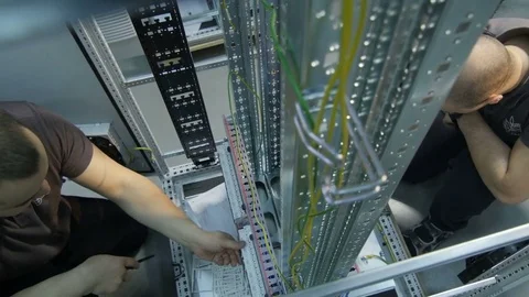 Upper View Workers Repair and Check Metal Machine Stock Footage 79432654