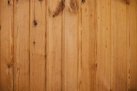 Upright texture of pine planks in dark caramel color Stock Photos