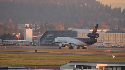 UPS Airlines MD11 slowing down on the runway afrer landing at PDX. Stock-Footage 121355732