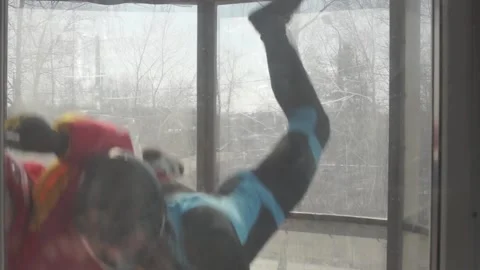 Ups and downs. pair flight training in an aero tube. free fall and gravity Stock Footage 91744090