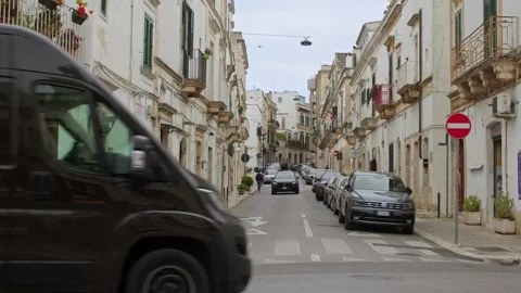 UPS delivery van driving through historic center of Ostuni Italy Stock Footage 336739722
