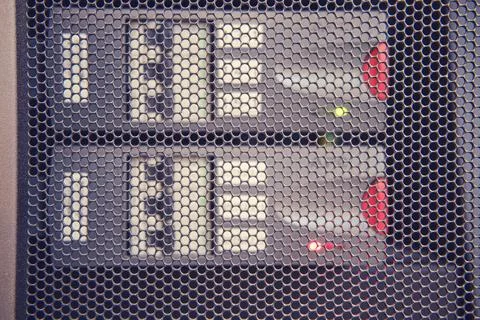 UPS module battery alarm in server room, red light warning error Stock Photos