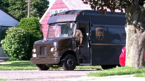 UPS Truck Driving off in Neighborhood Stock Footage