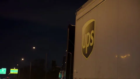 UPS United Parcel Service Truck driving on road of America. Night time in Stock Footage 311691253