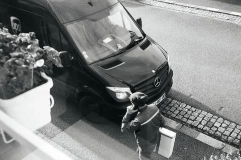 UPS van with postal worker view from above Stock Photos