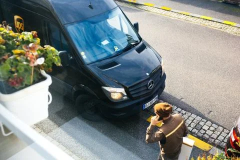 UPS van with postal worker view from above Stock Photos