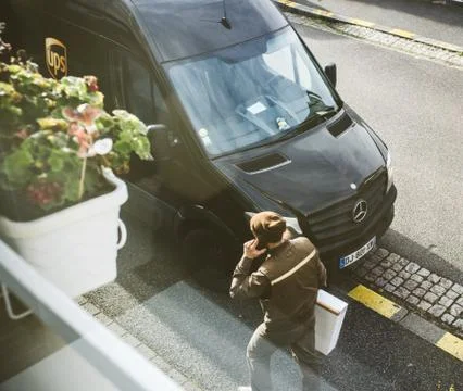 UPS van with postal worker view from above Stock Photos