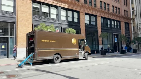 UPS Worker inside the Van moving Packages Stock Footage 239797017