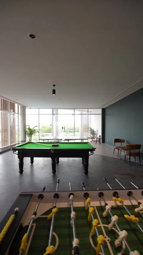 Upscale Apartment Amenity Area with Pool Table and Large Windows Stock-Footage 330156388