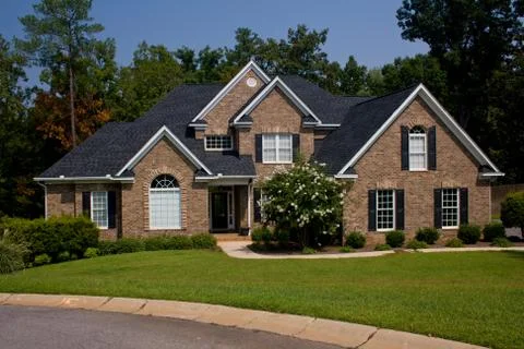 Upscale brick home Stock Photos