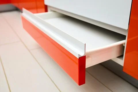 Upscale Maple Red kitchen drawer for plates or dishes shelf cabinet. Selective Stock Photos