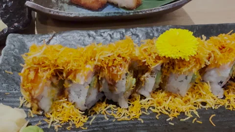 Upscale sushi roll on a black rectangular plate Stock Footage 331743167