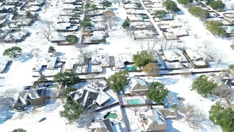 Upscale Waterside Estates near MacArthur Boulevard sits fully coated by Winter Stock Footage 327705172