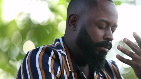 Upset African man feeling frustration and anxiety covering face with hand Stock Footage 155452607