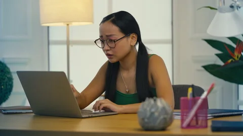 Upset Asian student reading bad news email, rejected from university application Stock Footage 313720230