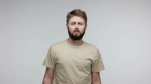 Upset bearded man desperately asking with prayer hand gesture, looking Stock Footage 134097016