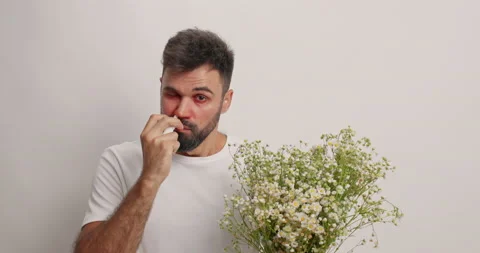 Upset bearded man suffers from allergic rhinitis uses nasal spray has seasonal Stock Footage 157677491