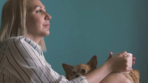 Upset blonde middle aged female looking in distance Stock Footage 166313618