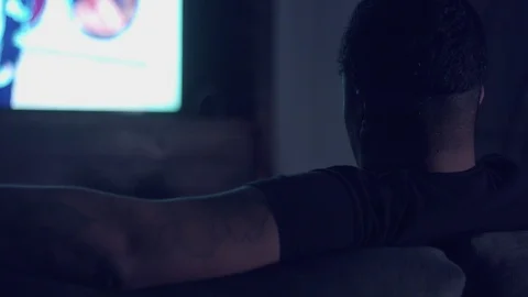 Upset boring mixed race man watching tv Stock Footage 87247953