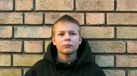 Upset boy against a wall Stock Footage 289472