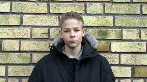 Upset boy against a wall Stock Footage 303246