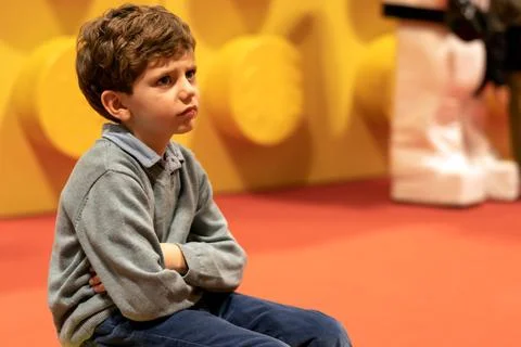 Upset boy sitting on bench Stock Photos