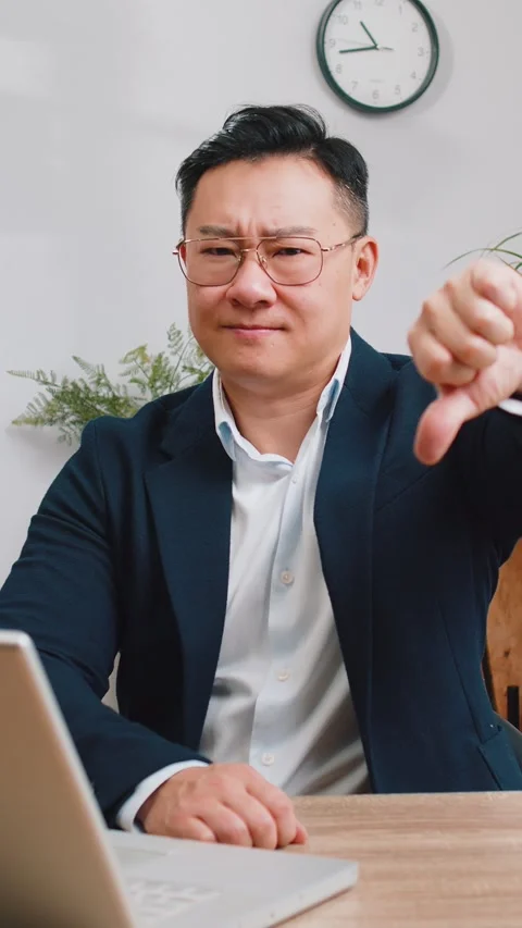 Upset businessman showing thumbs down, dislike bad work, disapproval Stock Footage 328196347