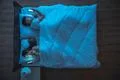 The upset couple with phone lie on the bed. night time. view from above Photo