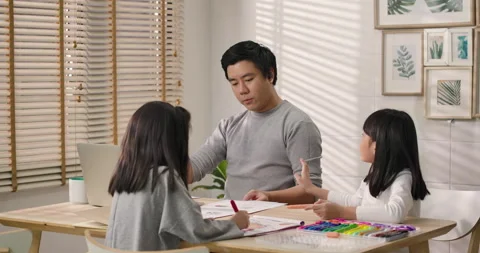 Upset daughter looking at hard working father Stock Footage 130584565