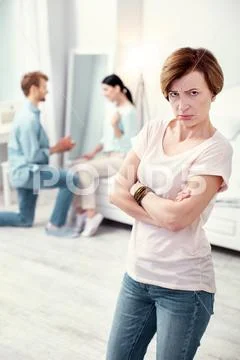 Upset depressed mother in law looking at you Stock Photos