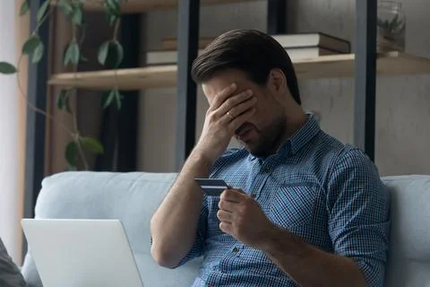 Upset desperate man having problems with wasting money Stock Photos