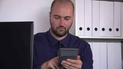 Upset desperate professional worker inside office stressful job data calculating Stock Footage
