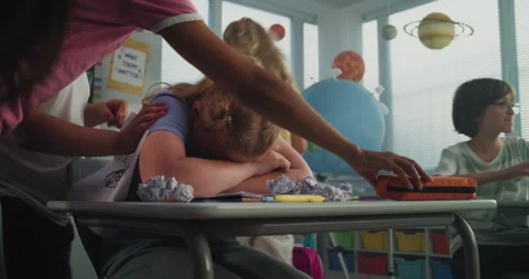 Upset Elementary School Girl Crying While Classmates Bullying Her, Laughing and Stock Footage 314022512