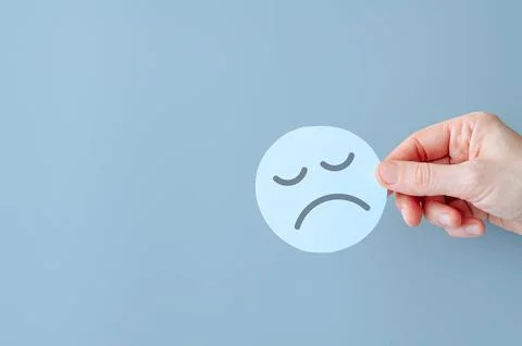 Upset face, top view, copy space. Blue Monday. Seasonal depression or disorder. Stock Photos