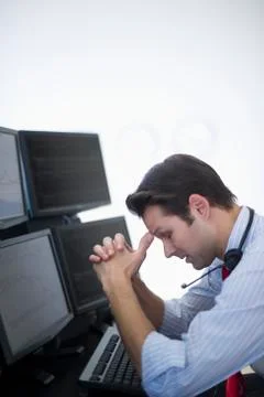 Upset financial worker analyzing data displayed on computer screen 스톡 사진